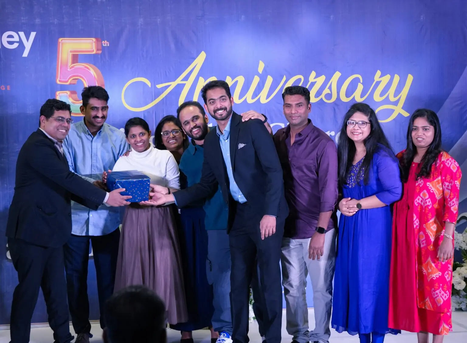 Members on stage at the church's fifth anniversary celebration