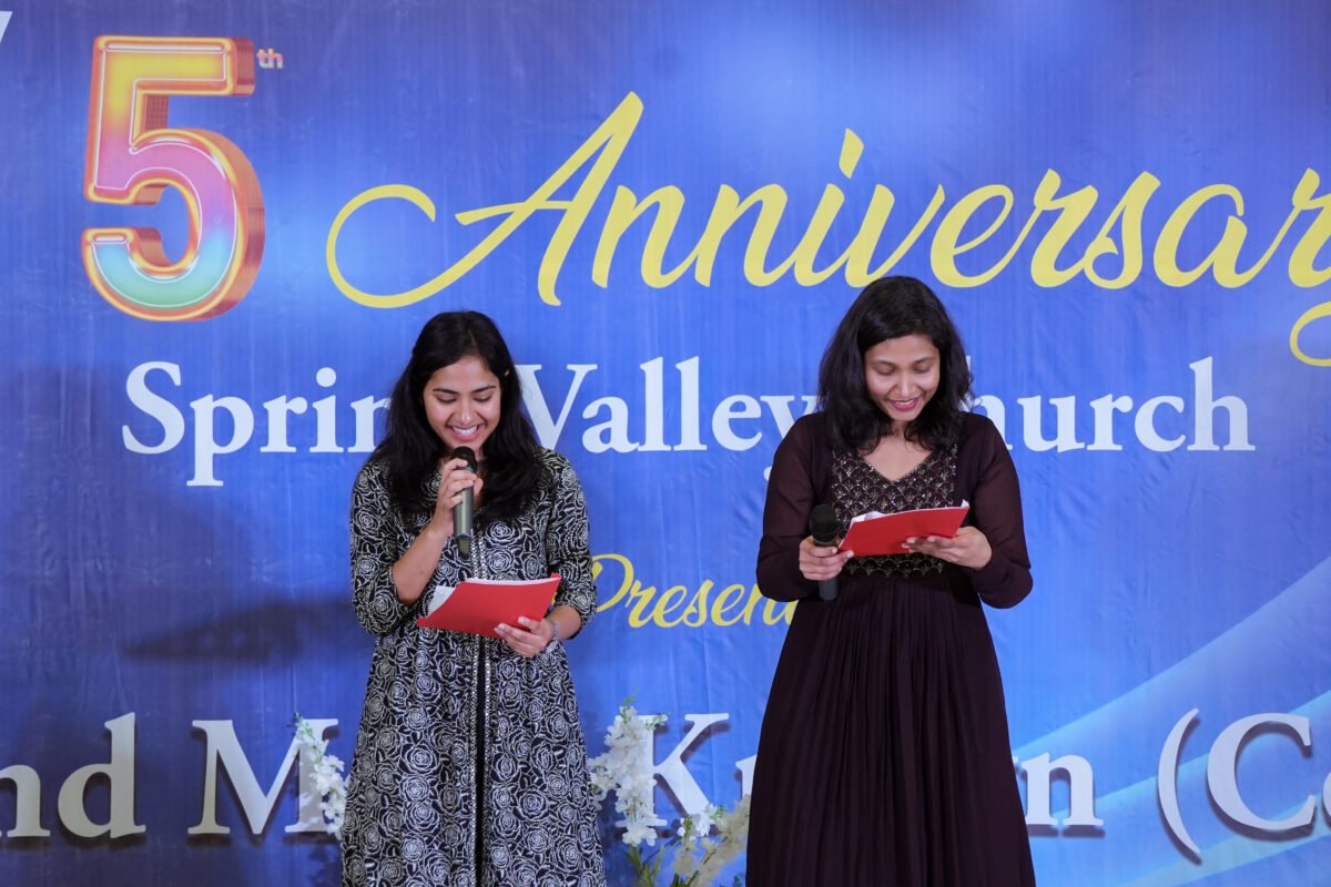 A young member speaking at the anniversary celebration