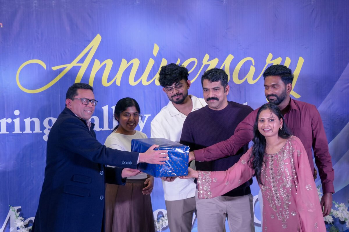 A gift being presented on stage at the anniversary celebration