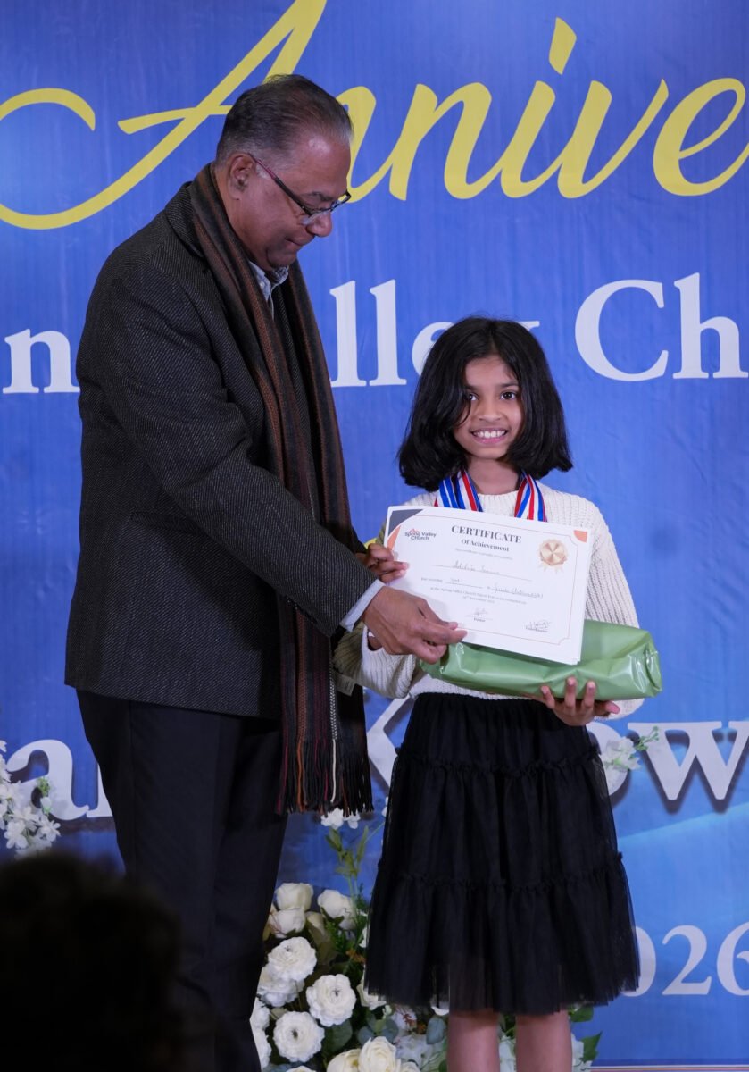 A child receiving a certificate at Spring Valley Church