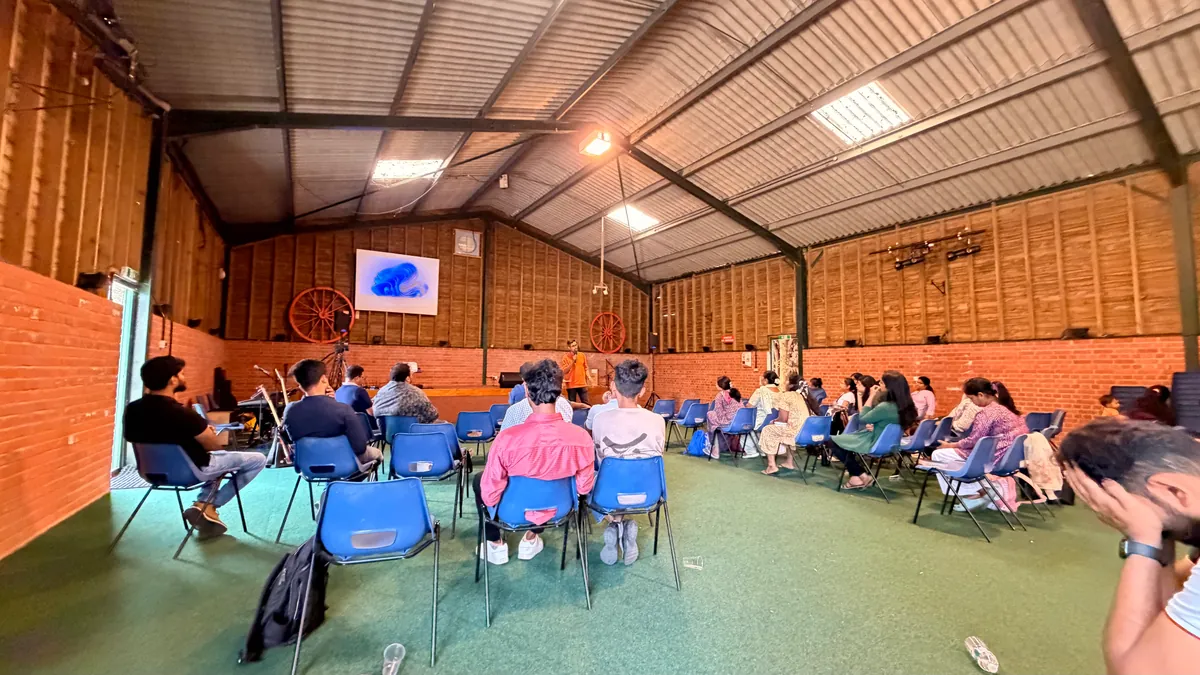 Church members sitting together in the barn hall during the annual retreat