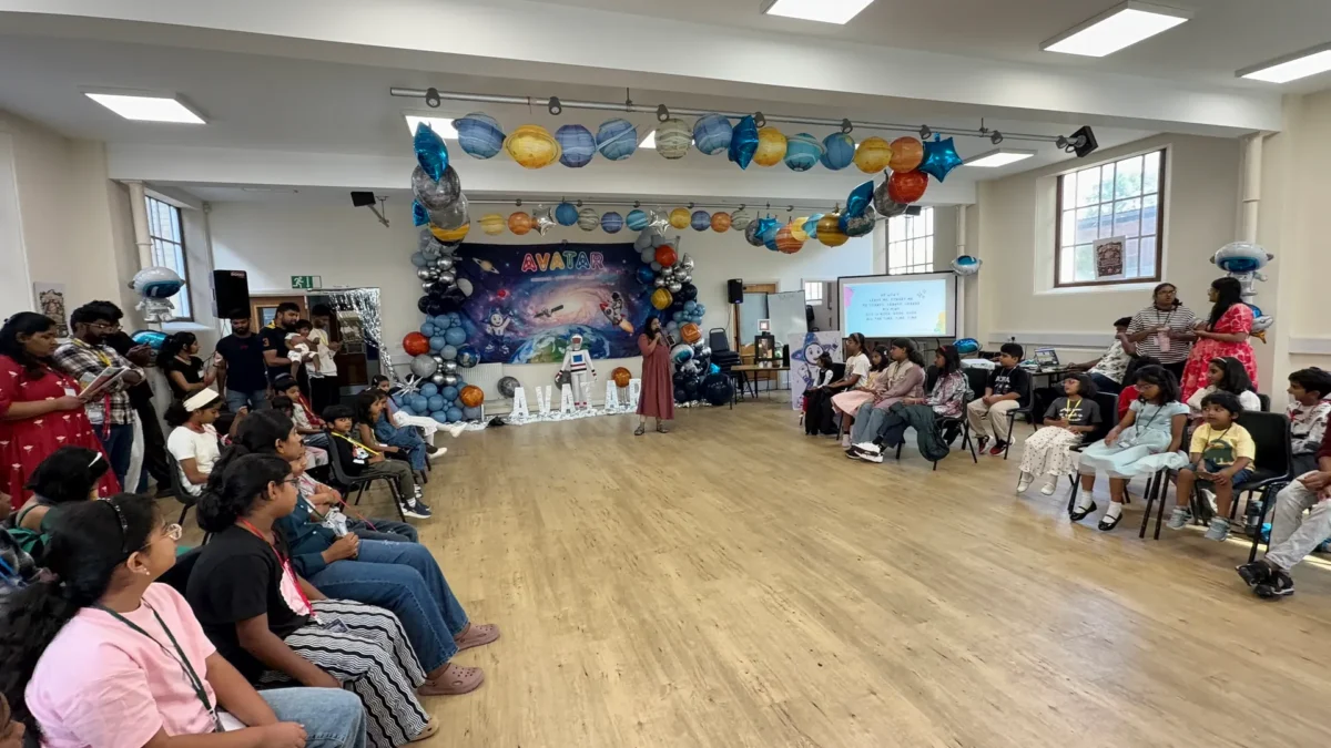 Children and leaders in the hall decorated for VBS, the church's summer holiday Bible club